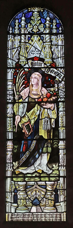 Stained glass window by Percy Bacon & Brothers, depicting Saint Dorothy; St Hilda's Church, Lucker, Northumberland.