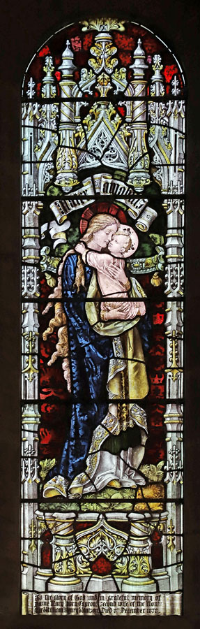 Stained glass window by Percy Bacon & Brothers, depicting Motherly Love; St Hilda's Church, Lucker, Northumberland.